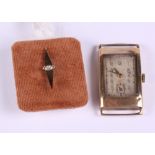 A gentleman's 9ct gold cased wristwatch and a yellow metal and diamond set tie pin