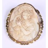 A carved ivory cameo, in yellow metal mount