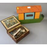 A 19th century wooden jigsaw, by Edward Wallace, in a wooden box disguised as a book, and a