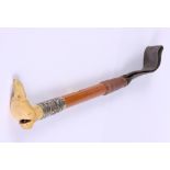 A carved bone and silver mounted riding crop with bone dog head whistle, 9" long