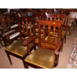 A set of six mahogany dining chairs with three Art nouveau design splats to backs and drop-in seats,