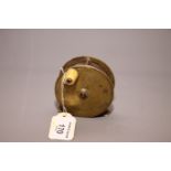 A mid 19th century 2 3/4" brass fishing reel, by Jones, 111 Jermyn Street, with ivory handle