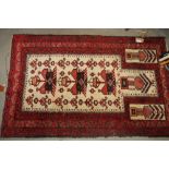 A Caucasian prayer rug decorated stylised motifs on an ivory ground with three border stipes, 55"