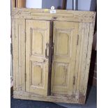 A pair of Indian twin panelled cupboard doors, revealing a Tanka in frame, 28" x 22"