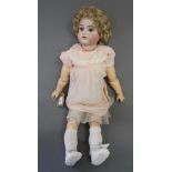 A Simon & Halbig bisque headed doll with sleeping eyes and open mouth, in pink lace trimmed dress,