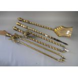 A set of three Victorian long handled brass fire irons and a pair of brass ember tongs