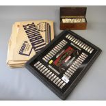 A set of bone and ebony dominoes, in wooden box, and an Autobridge playing board and deal sheets