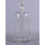 An 18th century Dutch engraved glass decanter and stopper, 9" high