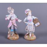 A pair of 19th century Berlin porcelain figures of children in early 19th century attire, 11" high
