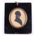 A mid 19th century portrait silhouette of an unknown man, 3" x 2 1/2", in ebonised frame