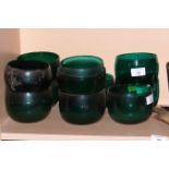 Eleven plain dark green glass finger bowls