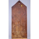 An arch top oak panel, carved figures of Adam and Eve in the Garden of Eden, 30" x 12", and a modern