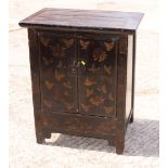 A Korean black and gilt decorated two door cabinet, 29" wide