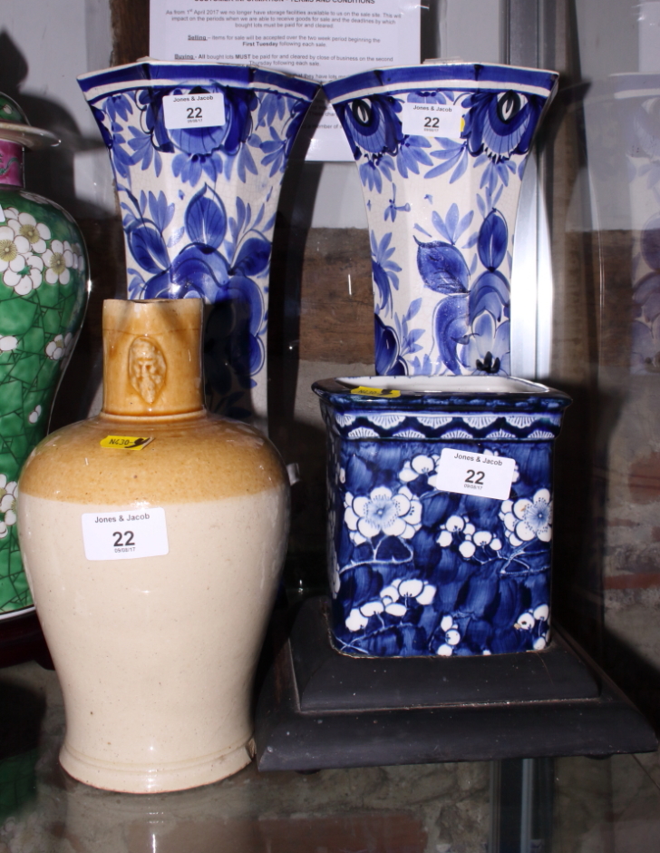 A pair of blue and white octagonal waisted vases, 15" high, a smaller, similar square planter and