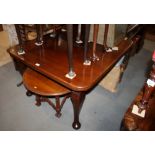 An Edwardian walnut extending dining table, on cabriole supports and pad feet, 60" wide max