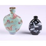 A 19th century Chinese porcelain snuff bottle decorated bats, seal mark to base, together with a