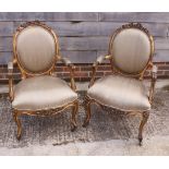A pair of Louis XV design giltwood open armchairs, upholstered in a green fabric