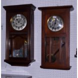 A 1920s oak cased wall clock, 26" high