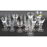 A collection of ten 19th century toastmasters' glasses with deceptive conical bowls