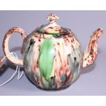 An 18th century Wheildon tortoiseshell ware teapot and cover, 5" high (chipped spout)