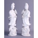 A pair of blanc de chine figures, Kuan Yin, on lotus bases, 10 1/2" high (restored)