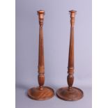 A pair of 19th century turned wood table lamps, on circular bases, 23" high