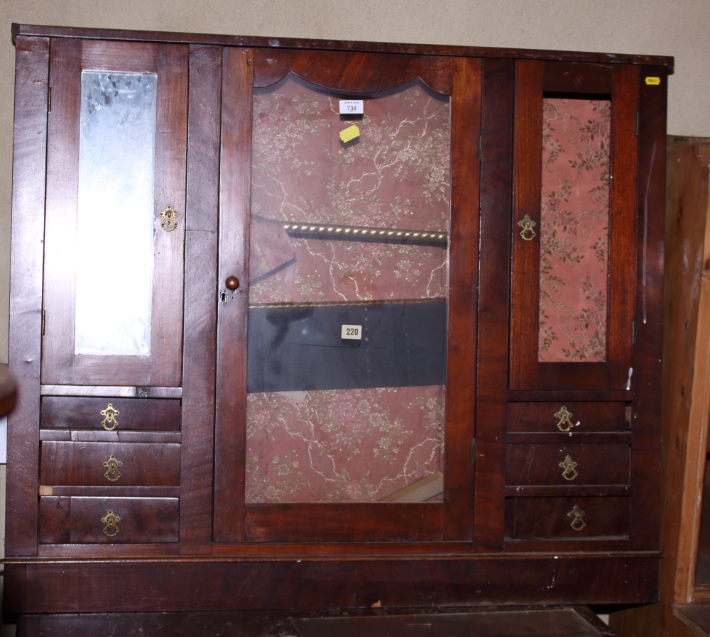 A 19th century mahogany cabinet with central glazed cupboard flanked by smaller mirrored cupboards