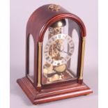 A mahogany cased skeleton clock with eight-day striking movement, 12" high