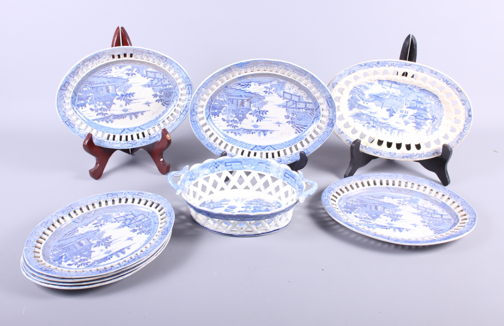 A set of five 19th century blue and white "Willow" pattern oval dishes with pierced rims, a chestnut