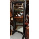An ebonised swing frame cheval mirror, plate 17" x 47"