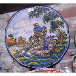 A Spanish majolica charger with Don Quixote and Sancho Panzer decoration, 18" dia