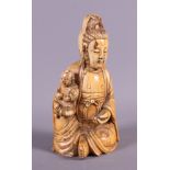 An antique carved ivory figure of Kuan Yin, 6" high