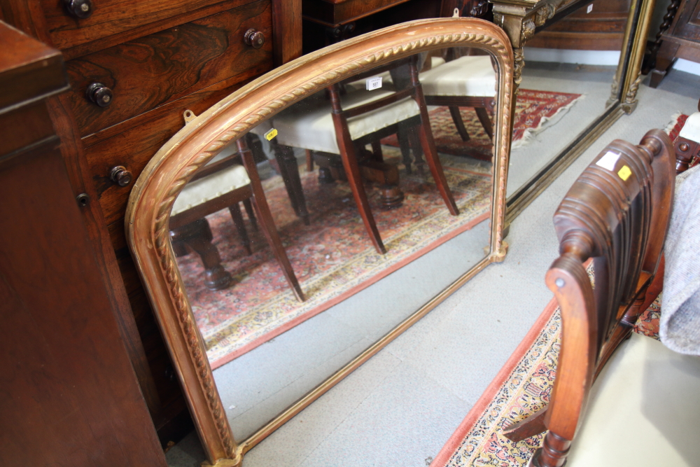 A 19th century arch top over mantel mirror, plate 38" x 28", in gilt frame