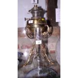 A late 19th century brass oil lamp (now converted to electricity) with two shades and a chimney