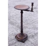 A Victorian figured walnut candle stand with circular top, on turned column, 12" dia