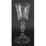 A 19th century glass goblet, bell-shaped bowl wheel engraved stag hunting scene, knopped stem with