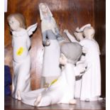 Two Lladro china ornaments of angels and three other Lladro figure ornaments of a woman and two