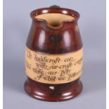 A Royal Doulton jug, inscribed "No handrcraft can with our craft compare. We make our pots of what