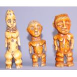 Three carved ivory standing figures, the tallest 5 1/2" high