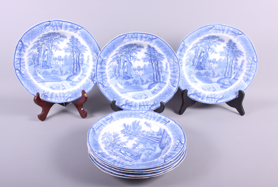 A set of eight Davenport blue and white landscape decorated soup plates