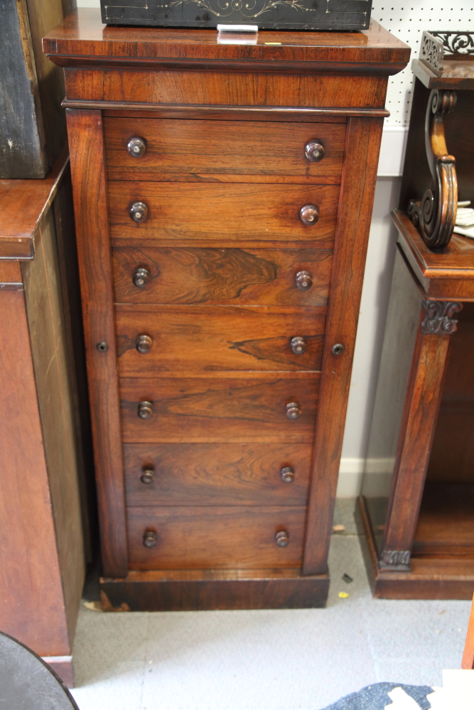 A 19th century rosewood Wellington chest, fitted seven drawers, 22" wide