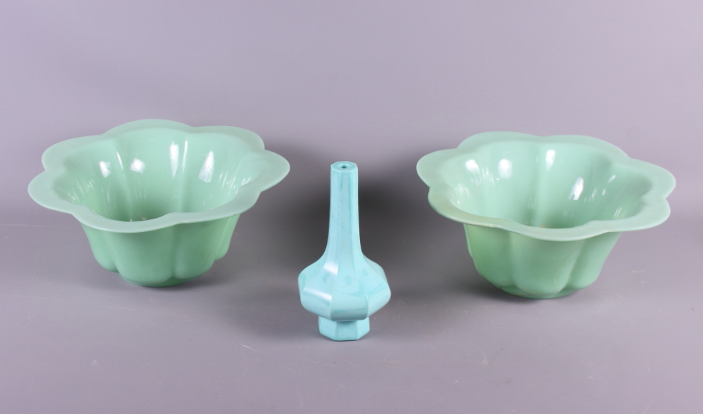 A pair of Chinese pale green Peking glass bowls of lobed form and a similar vase