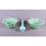 A pair of Chinese pale green Peking glass bowls of lobed form and a similar vase
