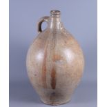 A 17th century stoneware Bellarmine jug, 17" high