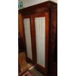 A 19th century Continental mahogany cupboard enclosed glazed doors, on bracket feet, 44" wide