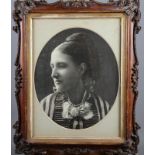 A 19th century photographic portrait of an unknown woman, in grained frame, and two other