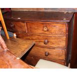 A Georgian mahogany bowfront chest of two short and three long drawers with turned wooden knobs,