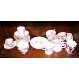 An assortment of lustre decorated cups and saucers and other decorative teaware