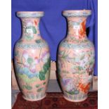 A pair of Chinese waterlily decorated vases on a peach ground, 24 1/2" high