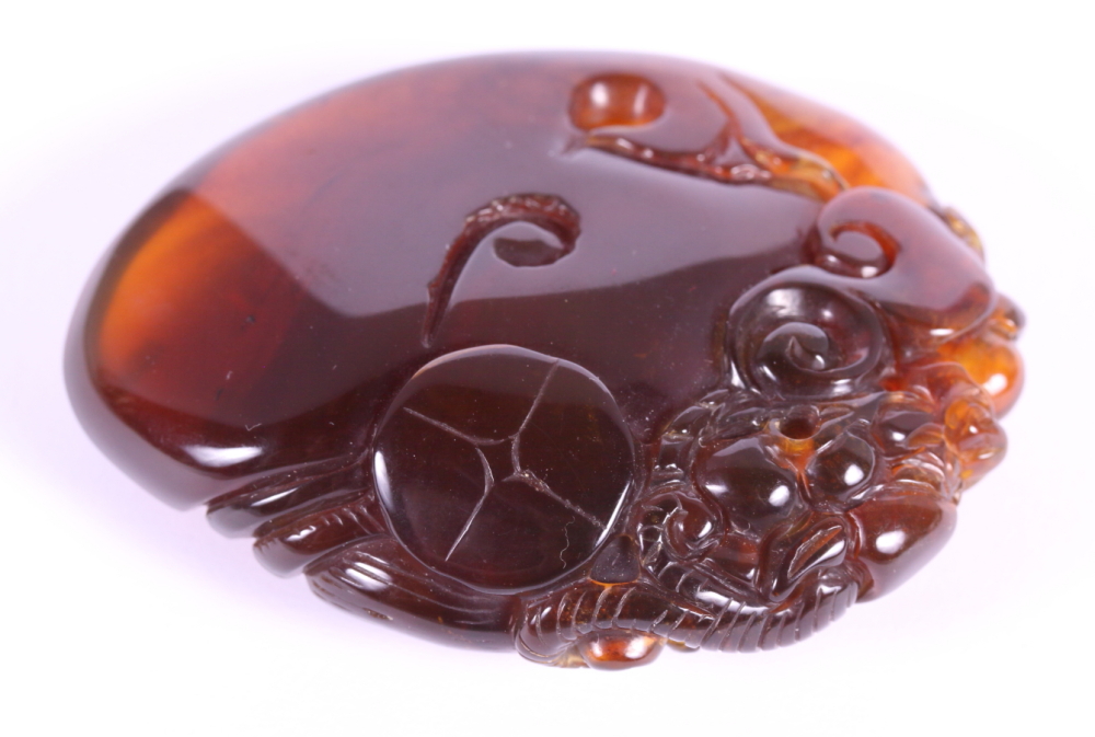 A Chinese carved amber pebble decorated dragon - Image 3 of 6